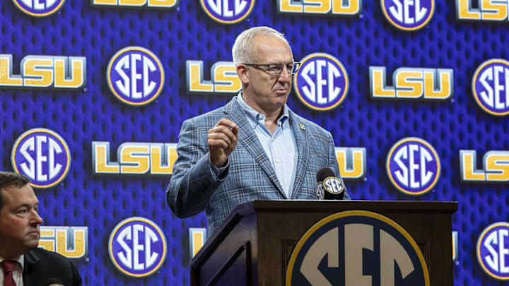 Oct 15, 2025; Birmingham, AL, USA; SEC commissioner Greg Sankey introduces LSU Tigers head coach Matt McMahon during SEC Media Days at Grand Bohemian Hotel. Mandatory Credit: Vasha Hunt-Imagn Images