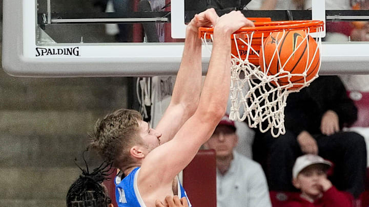 Feb 22, 2025; Tuscaloosa, AL, USA; Kentucky forward Andrew Carr (7) dunks over Alabama forward Jarin Stevenson (15) at Coleman Coliseum. Alabama defeated Kentucky 96-83. Mandatory Credit: Gary Cosby Jr.-Tuscaloosa News