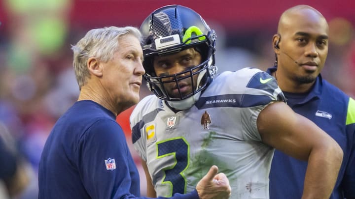 Jan 9, 2022; Glendale, Arizona, USA; Seattle Seahawks quarterback Russell Wilson (3) with head coach Pete Carroll against the Arizona Cardinals at State Farm Stadium. Mandatory Credit: Mark J. Rebilas-Imagn Images