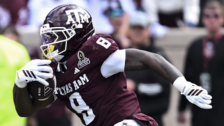 Dec 20, 2025; College Station, TX, USA; Texas A&M Aggies running back Le'Veon Moss (8) runs the ball against the Miami Hurricanes during the second half at Kyle Field. Mandatory Credit: Maria Lysaker-Imagn Images