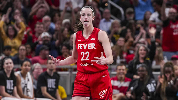 Sep 13, 2024; Indianapolis, Indiana, USA; Indiana Fever guard Caitlin Clark (22) reacts to scoring a 3-pointer Friday, Sept. 13, 2024, during a game between the Indiana Fever and the Las Vegas Aces on Friday, Sept. 13, 2024, at Gainbridge Fieldhouse in Indianapolis. The Aces defeated the Fever, 78-74. Mandatory Credit: Grace Smith/USA TODAY Network via Imagn Images Sep 13, 2024; Indianapolis, Indiana, USA; Indiana Fever guard Caitlin Clark (22) reacts to scoring a 3-pointer Friday, Sept. 13, 2024, during a game between the Indiana Fever and the Las Vegas Aces on Friday, Sept. 13, 2024, at Gainbridge Fieldhouse in Indianapolis. The Aces defeated the Fever, 78-74. Mandatory Credit: Grace Smith/USA TODAY Network via Imagn Images