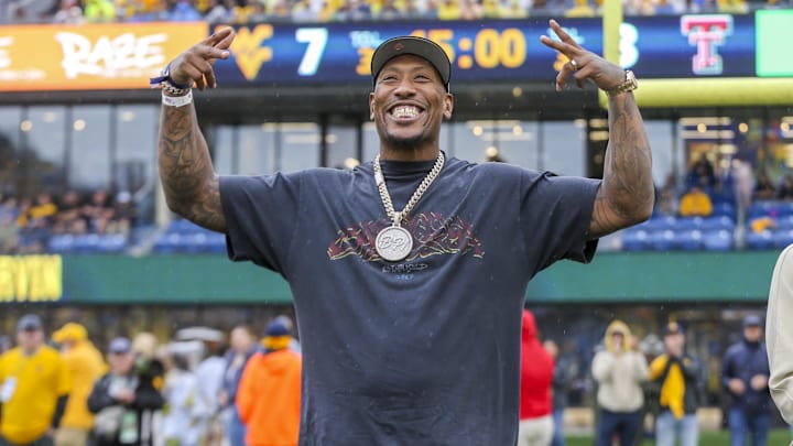 Sep 23, 2023; Morgantown, West Virginia, USA; Former West Virginia Mountaineer and current NFL player Bruce Irvin was honored during the first half as a member of the 2023 West Virginia University Sports Hall of Fame at Mountaineer Field at Milan Puskar Stadium. Mandatory Credit: Ben Queen-Imagn Images Sep 23, 2023; Morgantown, West Virginia, USA; Former West Virginia Mountaineer and current NFL player Bruce Irvin was honored during the first half as a member of the 2023 West Virginia University Sports Hall of Fame at Mountaineer Field at Milan Puskar Stadium. Mandatory Credit: Ben Queen-Imagn Images