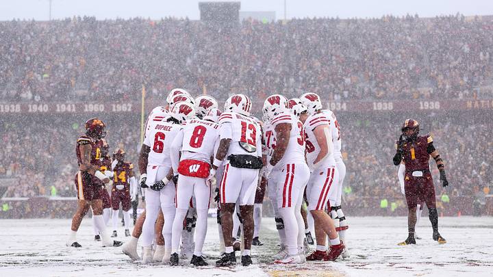 Nov 29, 2025; Minneapolis, Minnesota, USA; Wisconsin Badgers players huddle during the first half against the Minnesota Golden Gophers at Huntington Bank Stadium. Mandatory Credit: Matt Krohn-Imagn Images