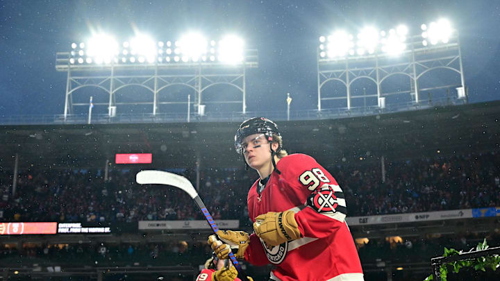 Dec 31, 2024; Chicago, Illinois, USA; Chicago Blackhawks center Connor Bedard (98) walks to the rink before the Winter Classic against the St. Louis Blues at Wrigley Field. Mandatory Credit: Daniel Bartel-Imagn Images