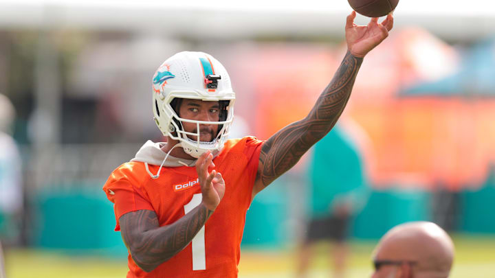 Jul 28, 2025; Miami Gardens, MI, USA; Miami Dolphins quarterback Tua Tagovailoa (1) throws the football during training camp at Baptist Health Training Complex. Mandatory Credit: Sam Navarro-Imagn Images
