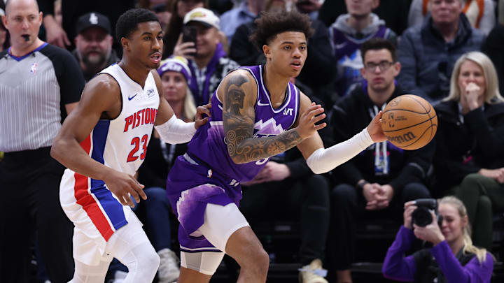 Jan 3, 2024; Salt Lake City, Utah, USA; Utah Jazz guard Keyonte George (3) passes the ball away from Detroit Pistons guard Jaden Ivey (23) during the third quarter at Delta Center. Mandatory Credit: Rob Gray-Imagn Images