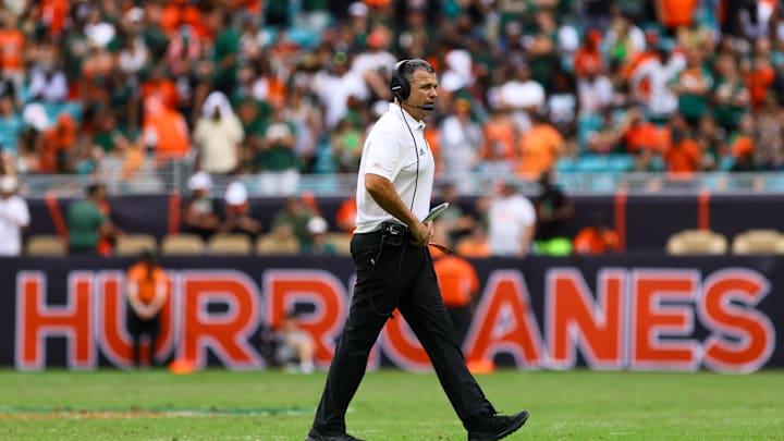 Nov 2, 2024; Miami Gardens, Florida, USA; Miami Hurricanes head coach Mario Cristobal looks on from the field against the Duke Blue Devils during the fourth quarter at Hard Rock Stadium. Mandatory Credit: Sam Navarro-Imagn Images