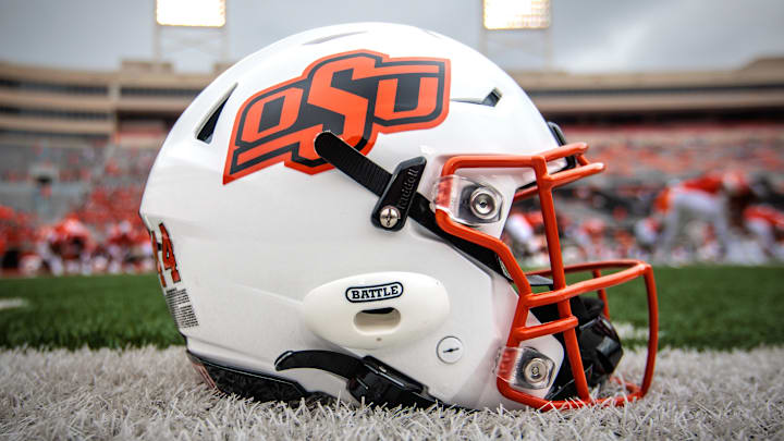 Aug 31, 2024; Stillwater, Oklahoma, USA; Oklahoma State Cowboys helmet sits on the field prior to the game against the South Dakota State Jackrabbits at Boone Pickens Stadium. Mandatory Credit: William Purnell-Imagn Images Aug 31, 2024; Stillwater, Oklahoma, USA; Oklahoma State Cowboys helmet sits on the field prior to the game against the South Dakota State Jackrabbits at Boone Pickens Stadium. Mandatory Credit: William Purnell-Imagn Images