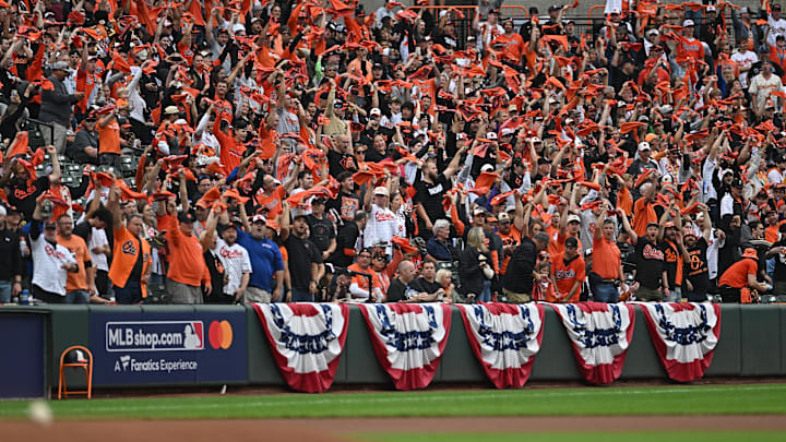 Oct 2, 2024; Baltimore, Maryland, USA; Baltimore Orioles fans wave rally towels before game two of the Wild Card round for the 2024 MLB Playoffs against the Kansas City Royals at Oriole Park at Camden Yards. Oct 2, 2024; Baltimore, Maryland, USA; Baltimore Orioles fans wave rally towels before game two of the Wild Card round for the 2024 MLB Playoffs against the Kansas City Royals at Oriole Park at Camden Yards.