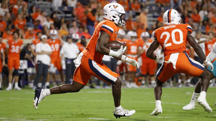 Aug 30, 2025; Charlottesville, Virginia, USA; Virginia Cavaliers wide receiver Cam Ross (6) carries the ball to score a touchdown against the Coastal Carolina Chanticleers during the second half at Scott Stadium. Mandatory Credit: Amber Searls-Imagn Images