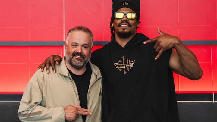 Nebraska football coach Matt Rhule poses with former Carolina Panther quarterback Cam Newton outside  the Osborne Legacy Complex during the Huskers' "Battle in the Boneyard". 