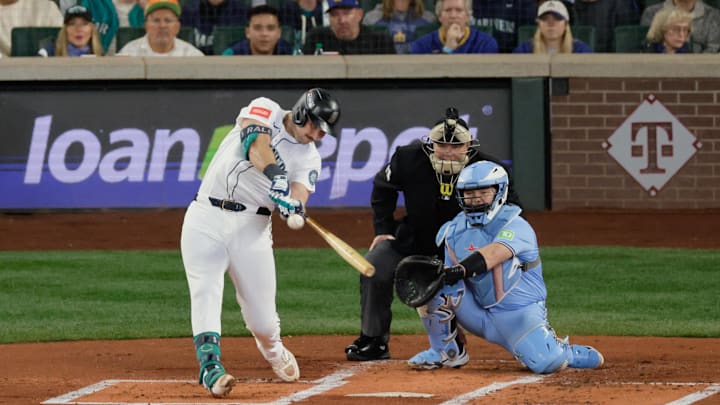 Oct 17, 2025; Seattle, Washington, USA; Seattle Mariners catcher Cal Raleigh (29) hits a double against the Toronto Blue Jays in the first inning during game five of the ALCS round for the 2025 MLB playoffs at T-Mobile Park. Mandatory Credit: John Froschauer-Imagn Images