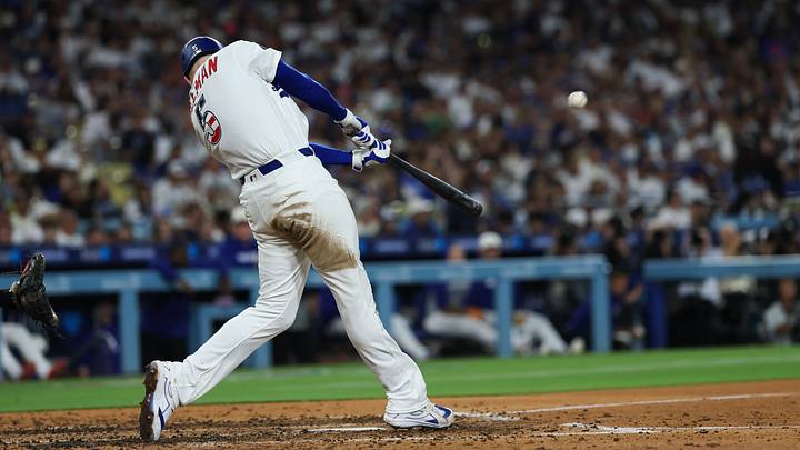 Jul 4, 2026; Los Angeles, California, USA; Los Angeles Dodgers first baseman Freddie Freeman (5) hits a home run in the sixth inning against the San Diego Padres at Dodger Stadium. Mandatory Credit: Kiyoshi Mio-Imagn Images