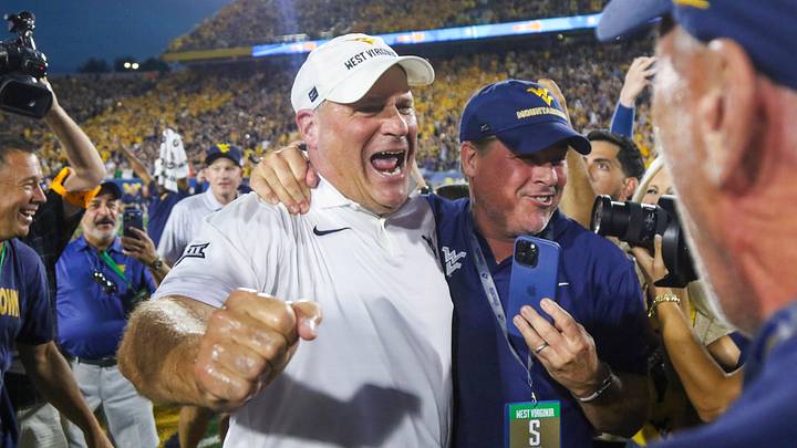 Sep 13, 2025; Morgantown, West Virginia, USA; West Virginia Mountaineers head coach Rich Rodriguez celebrates after defeating the Pittsburgh Panthers at Milan Puskar Stadium. Mandatory Credit: Ben Queen-Imagn Images Sep 13, 2025; Morgantown, West Virginia, USA; West Virginia Mountaineers head coach Rich Rodriguez celebrates after defeating the Pittsburgh Panthers at Milan Puskar Stadium. Mandatory Credit: Ben Queen-Imagn Images