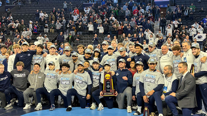 The Penn State wrestling team celebrates winning the team title at the 2025 NCAA Wrestling Championships.