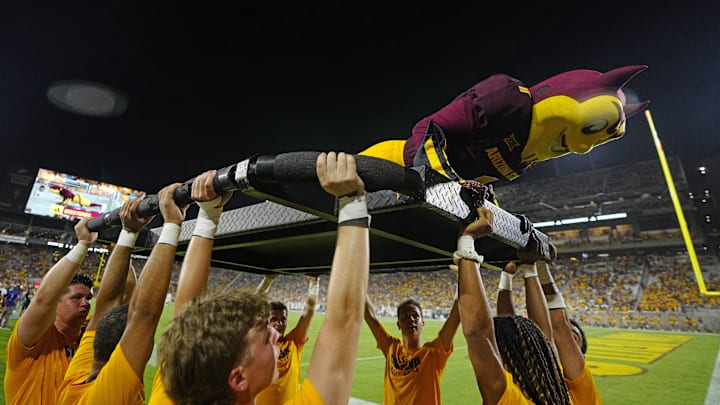 Sparky the Arizona State mascot does pushups after a touchdown against NAU during a game at Mountain America Stadium in Tempe on Aug. 30, 2025. Sparky the Arizona State mascot does pushups after a touchdown against NAU during a game at Mountain America Stadium in Tempe on Aug. 30, 2025.