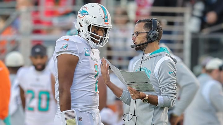 Miami Dolphins quarterback Tua Tagovailoa (1) talks with Head Coach Mike McDaniel