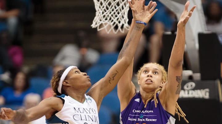 Jun 27, 2015; Minneapolis, MN, USA; Minnesota Lynx forward Rebekkah Brunson (32) and Phoenix Mercury center Brittney Griner (42) rebound in the fourth quarter at Target Center. The Minnesota Lynx beat the Phoenix Mercury 71-56.  Mandatory Credit: Brad Rempel-Imagn Images