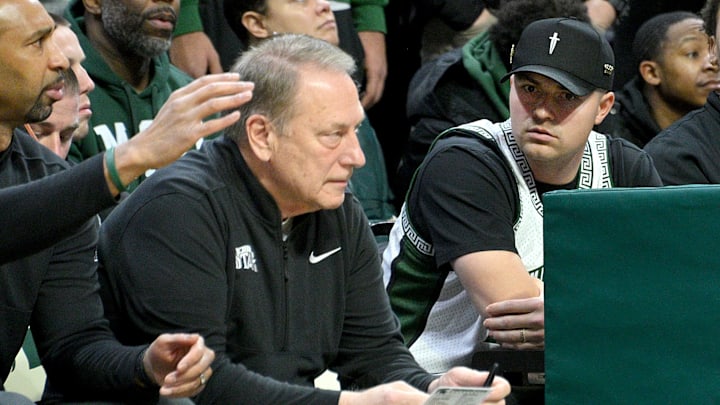 Jan 19, 2025; East Lansing, Michigan, USA;  Tigers Cy Young award winner Tarik Skubal watches Michigan State Spartans head coach Tom Izzo during the first half against the Illinois Fighting Illini at Jack Breslin Student Events Center. Mandatory Credit: Dale Young-Imagn Images