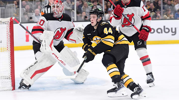 Apr 14, 2026; Boston, Massachusetts, USA; New Jersey Devils goalie Nico Daws (50) looks on as defenseman Simon Nemec (17) and Boston Bruins forward James Hagens (44) go after the puck during the first period at TD Garden. Mandatory Credit: Bob DeChiara-Imagn Images Apr 14, 2026; Boston, Massachusetts, USA; New Jersey Devils goalie Nico Daws (50) looks on as defenseman Simon Nemec (17) and Boston Bruins forward James Hagens (44) go after the puck during the first period at TD Garden. Mandatory Credit: Bob DeChiara-Imagn Images