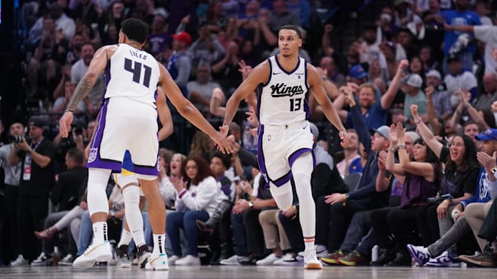 Apr 16, 2024; Sacramento, California, USA; Sacramento Kings forward Keegan Murray (13) is congratulated by forward Trey Lyles (41) after making a three point basket against the Golden State Warriors in the fourth quarter during a play-in game of the 2024 NBA playoffs at the Golden 1 Center. Mandatory Credit: Cary Edmondson-USA TODAY Sports
