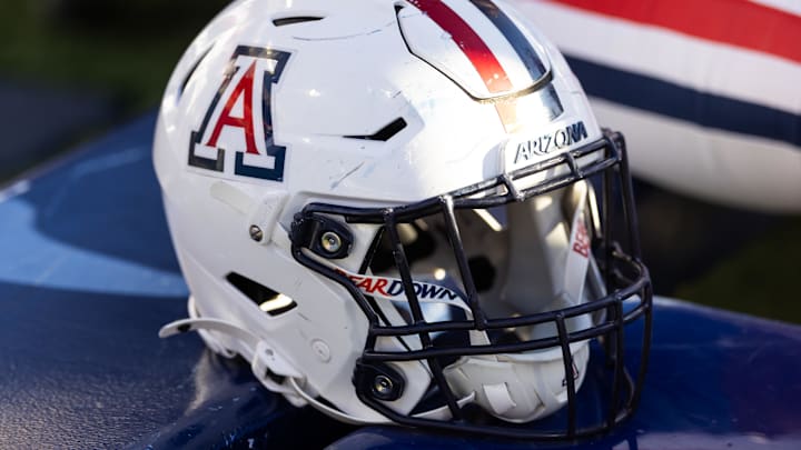 Nov 8, 2025; Tucson, Arizona, USA; Detailed view of an Arizona Wildcats helmet at Arizona Stadium. Mandatory Credit: Mark J. Rebilas-Imagn Images Nov 8, 2025; Tucson, Arizona, USA; Detailed view of an Arizona Wildcats helmet at Arizona Stadium. Mandatory Credit: Mark J. Rebilas-Imagn Images