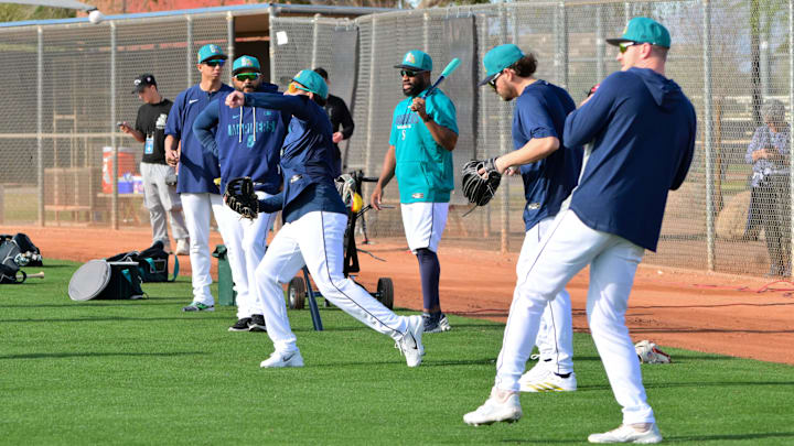 Feb 12, 2026; Peoria, AZ, USA; Seattle Mariners players warm up during a Spring Training workout at Peoria Sports Complex. Mandatory Credit: Matt Kartozian-Imagn Images Feb 12, 2026; Peoria, AZ, USA; Seattle Mariners players warm up during a Spring Training workout at Peoria Sports Complex. Mandatory Credit: Matt Kartozian-Imagn Images