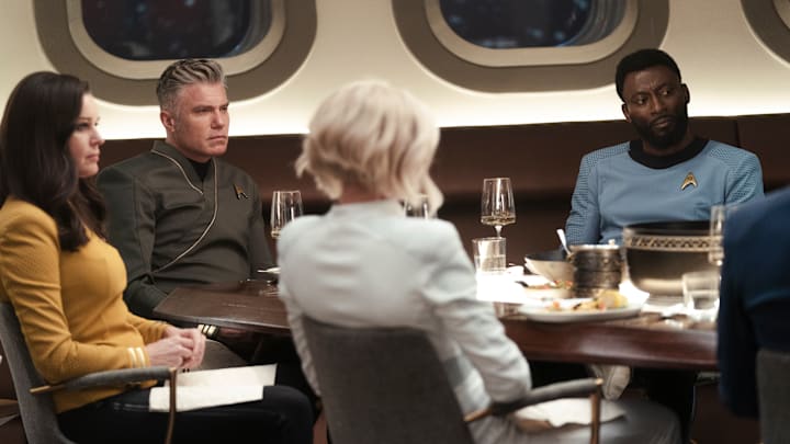 L-R Rebecca Romjin as Una, Anson Mount as Capt. Pike and Babs Olusanmokun as Dr. M'Benga in Star Trek: Strange New Worlds streaming on Paramount+, 2023. Photo Credit: John Medland/Paramount+