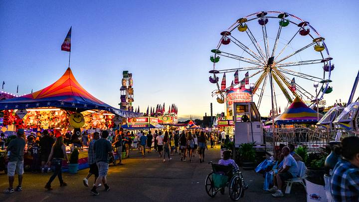 Minnesota State Fair's busy midway area at dusk. Minnesota State Fair's busy midway area at dusk.