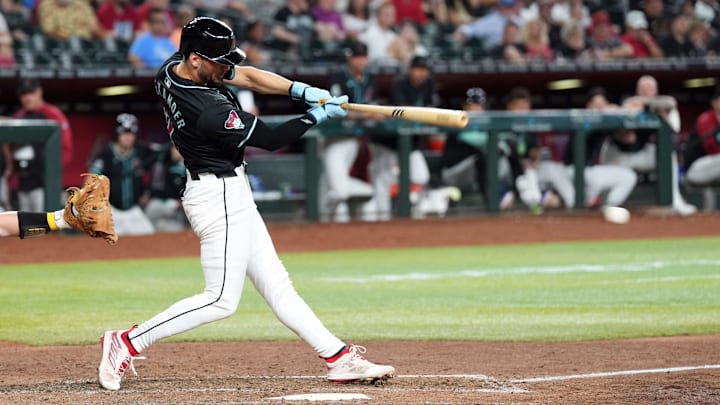 Jun 30, 2024; Phoenix, Arizona, USA; Arizona Diamondbacks pinch hitter Blaze Alexander (9) hits a two RBI single against the Oakland Athletics during the seventh inning at Chase Field. Mandatory Credit: Joe Camporeale-Imagn Images
