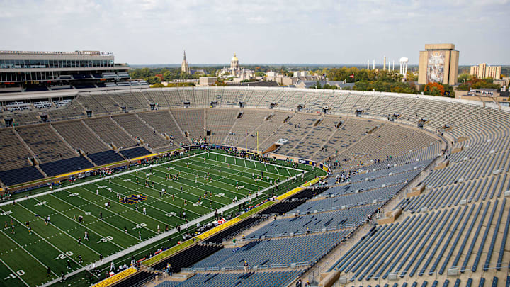 Players warm up on the field before a NCAA college football game between Notre Dame and Stanford at Notre Dame Stadium on Saturday, Oct. 12, 2024, in South Bend.