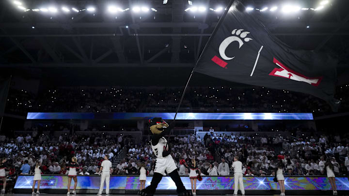 Jan 11, 2025; Cincinnati, Ohio, USA; Cincinnati mascot The Bearcat performs before the game between the Kansas Jayhawks and the Cincinnati Bearcats at Fifth Third Arena. Mandatory Credit: Aaron Doster-Imagn Images Jan 11, 2025; Cincinnati, Ohio, USA; Cincinnati mascot The Bearcat performs before the game between the Kansas Jayhawks and the Cincinnati Bearcats at Fifth Third Arena. Mandatory Credit: Aaron Doster-Imagn Images