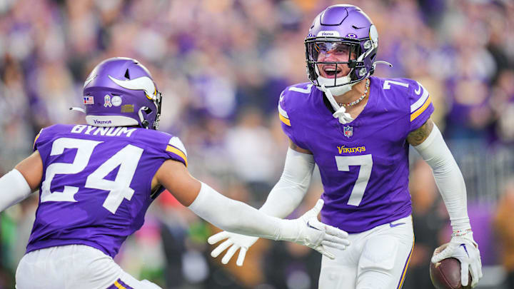 Nov 12, 2023; Minneapolis, Minnesota, USA; Minnesota Vikings cornerback Byron Murphy Jr. (7) celebrates his interception with safety Camryn Bynum (24) against the New Orleans Saints in the fourth quarter at U.S. Bank Stadium.