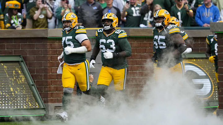Sep 7, 2025; Green Bay, Wisconsin, USA;  Green Bay Packers guard Sean Rhyan (75), offensive tackle Rasheed Walker (63) and guard Aaron Banks (65) prior to the game against the Detroit Lions at Lambeau Field. Mandatory Credit: Jeff Hanisch-Imagn Images
