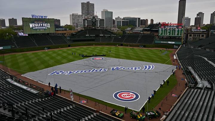 May 3, 2026; Chicago, Illinois, USA; A general wide view of the rain tarp over the field prior to a game between the Chicago Cubs and the Arizona Diamondbacks at Wrigley Field. Mandatory Credit: Patrick Gorski-Imagn Images May 3, 2026; Chicago, Illinois, USA; A general wide view of the rain tarp over the field prior to a game between the Chicago Cubs and the Arizona Diamondbacks at Wrigley Field. Mandatory Credit: Patrick Gorski-Imagn Images