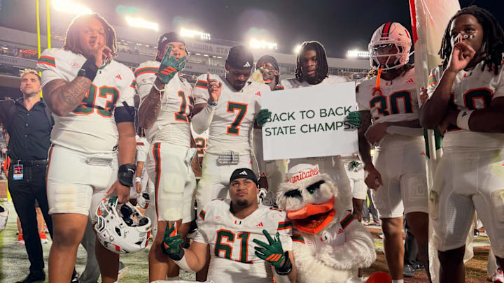 Miami Hurricanes posing after victory over Florida State