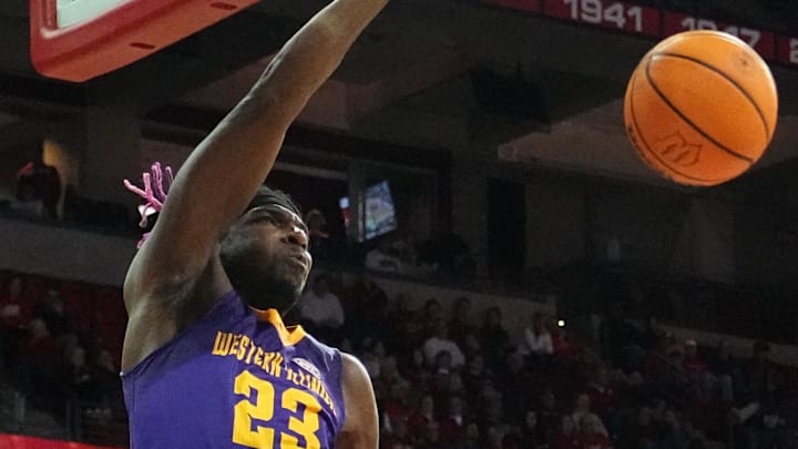 November 27, 2023; Madison, Wisconsin; Western Illinois center Drew Cisse (23) dunks the ball 