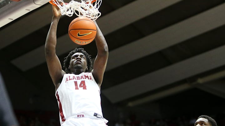 Jan 31, 2023; Tuscaloosa, AL, USA; Alabama center Charles Bediako (14) slams a dunk home with Vanderbilt forward Malik Dia (23) defending at Coleman Coliseum.

Ncaa Basketball Sec Basketball Alabama Vs Vanderbilt