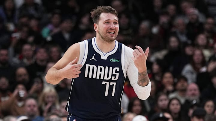Feb 28, 2024; Toronto, Ontario, CAN; Dallas Mavericks guard Luka Doncic (77) reacts after scoring a basket against the Toronto Raptors during the third quarter at Scotiabank Arena. Mandatory Credit: Nick Turchiaro-Imagn Images