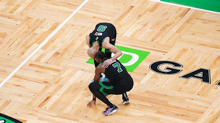 Jun 9, 2024; Boston, Massachusetts, USA: Boston Celtics guard Jaylen Brown (7) reacts with guard Derrick White (9) after defeating the Dallas Mavericks in game two of the 2024 NBA Finals at TD Garden. Mandatory Credit: David Butler II-Imagn Images