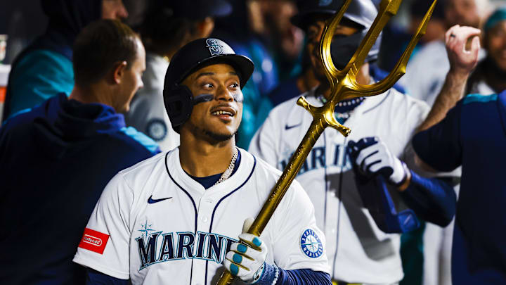 Seattle Mariners designated hitter Jorge Polanco celebrates in the dugout after a home run against the Los Angeles Angels on April 29 at T-Mobile Park. Seattle Mariners designated hitter Jorge Polanco celebrates in the dugout after a home run against the Los Angeles Angels on April 29 at T-Mobile Park.