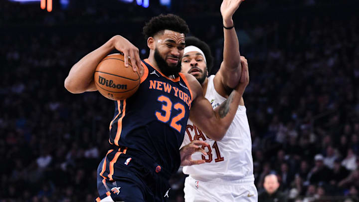 Oct 28, 2024; New York, New York, USA; New York Knicks center Karl-Anthony Towns (32) drives to the basket while being defended by Cleveland Cavaliers center Jarrett Allen (31) during the first half at Madison Square Garden. Mandatory Credit: John Jones-Imagn Images