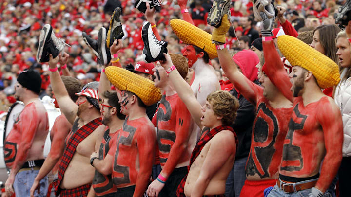  Nebraska Cornhuskers fans hold their shoes up