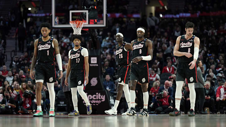 Dec 6, 2024; Portland, Oregon, USA; Portland Trail Blazers (from left to right) Anfernee Simons (1), Shaedon Sharpe (17), Duop Reath (26), Jerami Grant (9), and Deni Avdija (8) walk back to the court after a timeout during the first half against the Utah Jazz at Moda Center. Mandatory Credit: Soobum Im-Imagn Images Dec 6, 2024; Portland, Oregon, USA; Portland Trail Blazers (from left to right) Anfernee Simons (1), Shaedon Sharpe (17), Duop Reath (26), Jerami Grant (9), and Deni Avdija (8) walk back to the court after a timeout during the first half against the Utah Jazz at Moda Center. Mandatory Credit: Soobum Im-Imagn Images