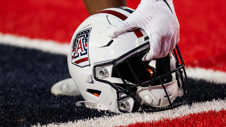 Oct 5, 2024; Tucson, Arizona, USA; Arizona Wildcats helmet gets picked before the game against the Texas Tech Red Raiders at Arizona Stadium. Mandatory Credit: Aryanna Frank-Imagn Images