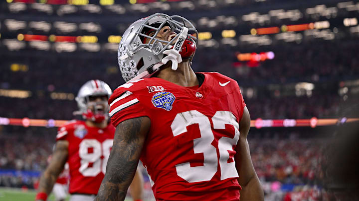 Ohio State Buckeyes running back TreVeyon Henderson (32) scores a touchdown on a pass from quarterback Will Howard (not pictured) during the second quarter at AT&T Stadium. 