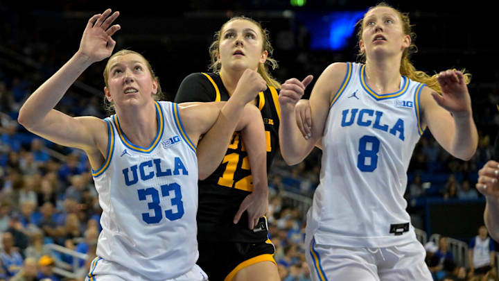Feb 1, 2026; Los Angeles, California, USA; UCLA Bruins forward Amanda Muse (33) and guard Gianna Kneepkens (8) box out Iowa Hawkeyes center Layla Hays (12) in the second half at Pauley Pavilion presented by Wescom Financial. Mandatory Credit: Jayne Kamin-Oncea-Imagn Images Feb 1, 2026; Los Angeles, California, USA; UCLA Bruins forward Amanda Muse (33) and guard Gianna Kneepkens (8) box out Iowa Hawkeyes center Layla Hays (12) in the second half at Pauley Pavilion presented by Wescom Financial. Mandatory Credit: Jayne Kamin-Oncea-Imagn Images