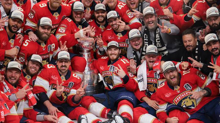 Jun 17, 2025; Sunrise, Florida, USA; The Florida Panthers pose for a photo with the Stanley Cup after winning game six of the 2025 Stanley Cup Final against the Edmonton Oilers at Amerant Bank Arena. Mandatory Credit: Sam Navarro-Imagn Images
