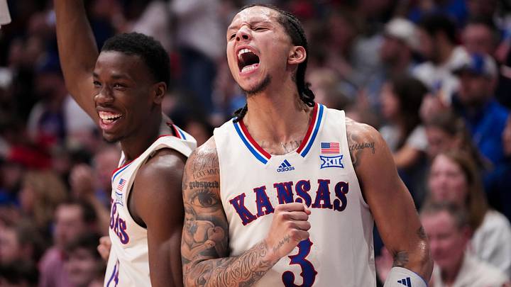 Dec 22, 2025; Lawrence, Kansas, USA; Kansas Jayhawks guard Melvin Council Jr. (14) and guard Tre White (3) celebrate on the bench against the Davidson Wildcats during the second half of the game at Allen Fieldhouse. Mandatory Credit: Denny Medley-Imagn Images Dec 22, 2025; Lawrence, Kansas, USA; Kansas Jayhawks guard Melvin Council Jr. (14) and guard Tre White (3) celebrate on the bench against the Davidson Wildcats during the second half of the game at Allen Fieldhouse. Mandatory Credit: Denny Medley-Imagn Images