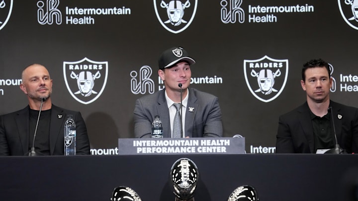 Apr 24, 2026; Henderson, NV, USA; Las Vegas Raiders quarterback Fernando Mendoza (center) speaks at introductory press conference at Intermountain Health Performance Center flanked by general manager John Spytek (left) and head coach Klint Kubiak after being selected as the No. 1 pick in the 2026 NFL Draft. Mandatory Credit: Kirby Lee-Imagn Images